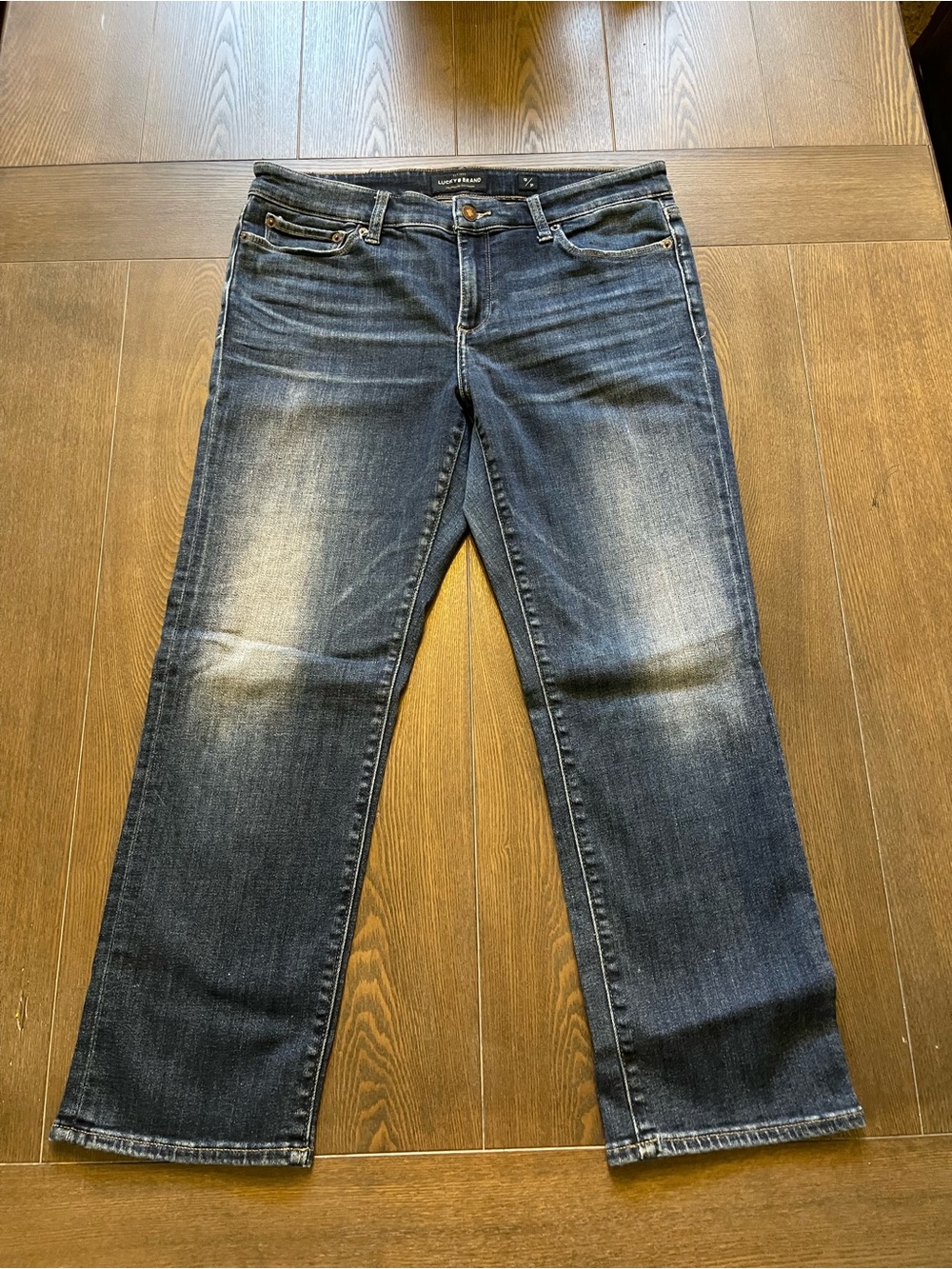 Lucky Brand Women’s Cropped Dark Blue Denim Jeans w/ some distressing. Size 12.